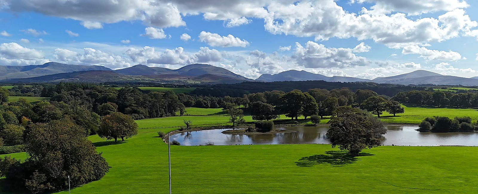 The Vaynol Estate grounds, with Eryri (Snowdonia) in the distance