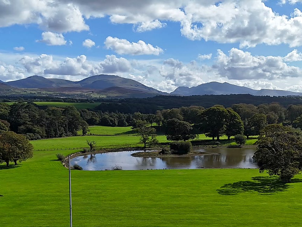 The Vaynol Estate grounds, with Eryri (Snowdonia) in the distance
